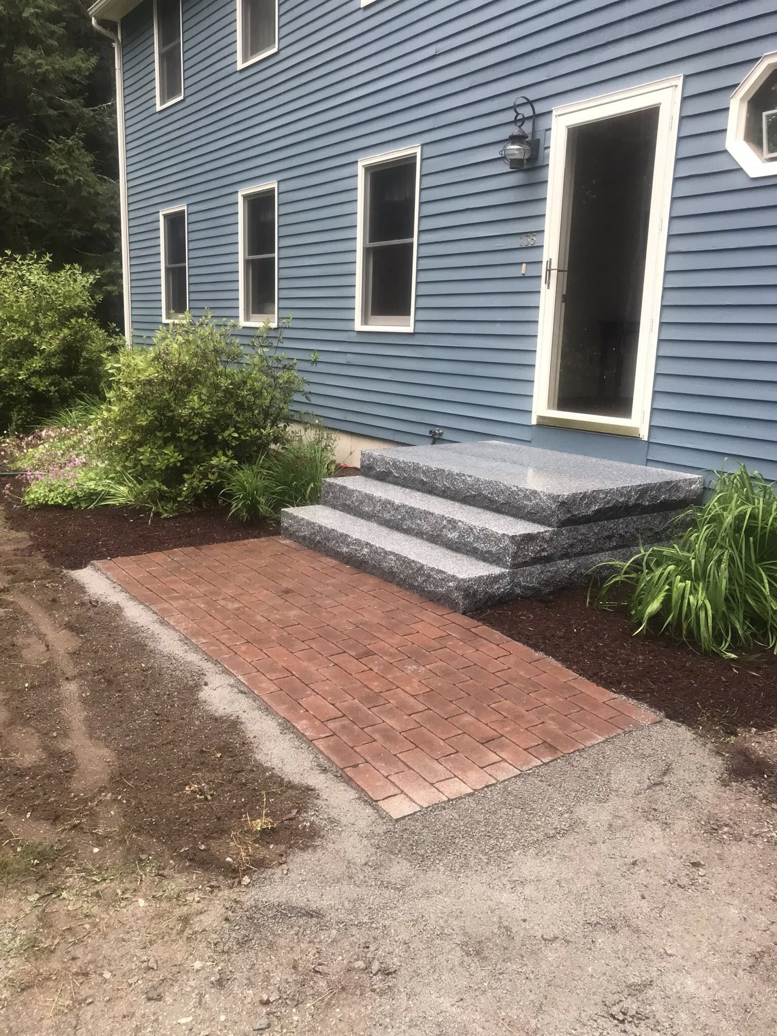 New granite steps with brick paver walkway
